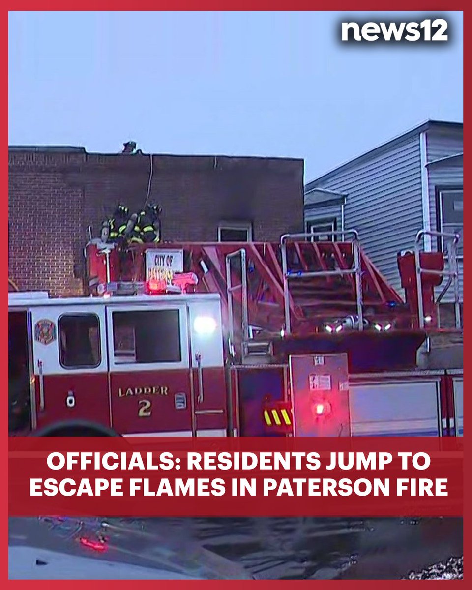 Officials say residents jumped from second-floor apartments and a battalion chief was injured in a three-alarm fire this morning.