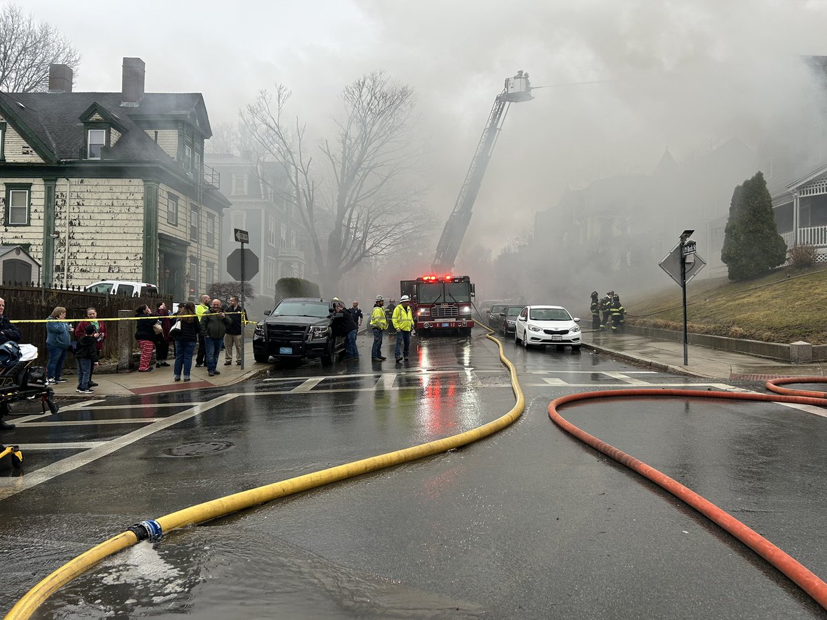 House fire on Locust St in Fall River, heavy smoke pouring out of the house, crews still working to put any flames out