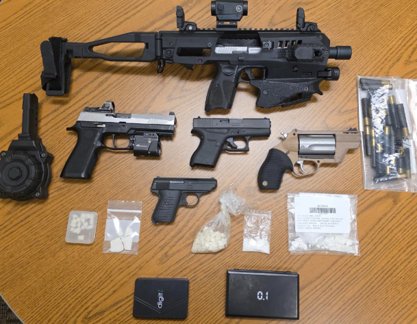 Officers executed a search warrant a suspect's apartment, where they seized five handguns, approximately 1.5 ounces of crack cocaine, and 9 grams of methamphetamine and fentanyl