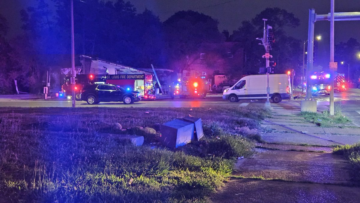 St. Louis PD & FD on the scene of a two car crash at Vandeventer & Page. One person has died. One of the vehicles crashed into a market, caught fire, and then caught the building on fire