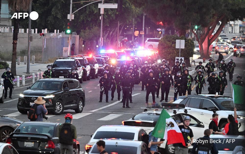 LA police say arrests underway as protesters defy curfew