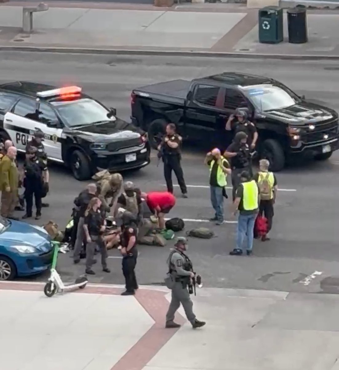 Shots fired near downtown demonstration; at least 1 victim critically injured, person of interest in custody