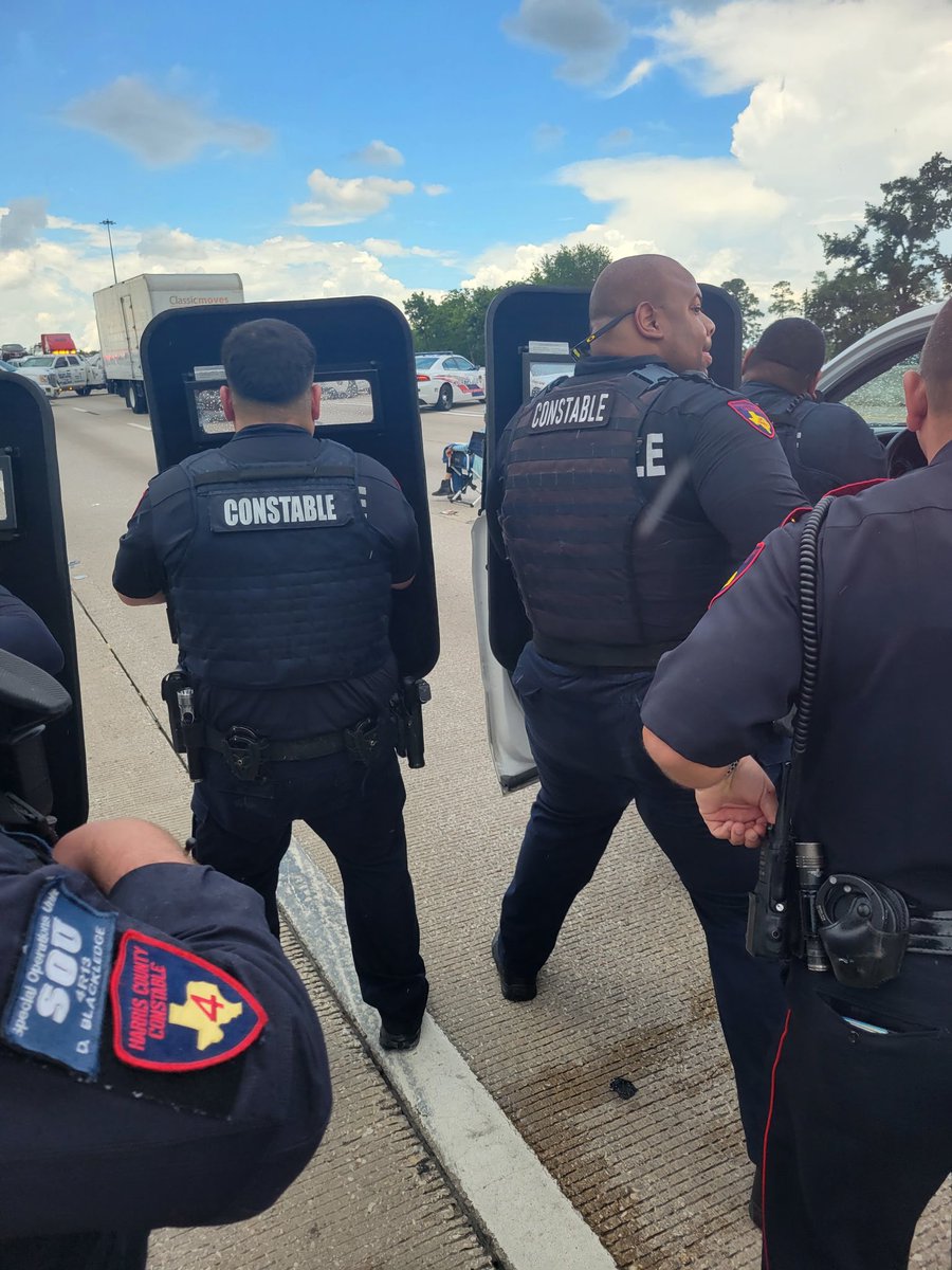 A woman sitting in a chair with a gun is in a standoff with police on the North Freeway in Houston.Officials say the incident began after a car accident
