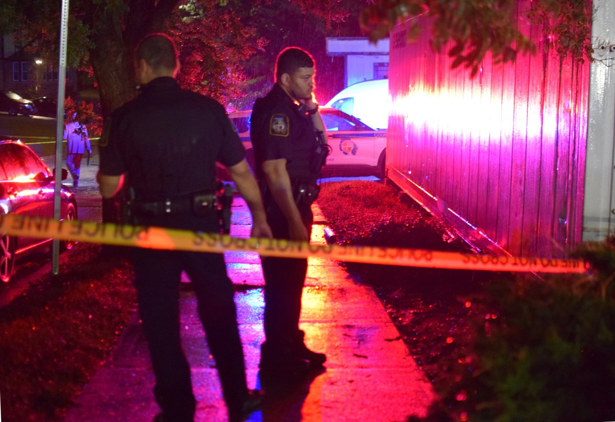 Baltimore County officers guard a crime scene in the 3600 block of Tulsa Road after discovering a gunshot victim had died from their injuries on Monday night. The deceased individual could be seen lying in the front yard of a home on the block with a plastic tarp over his body