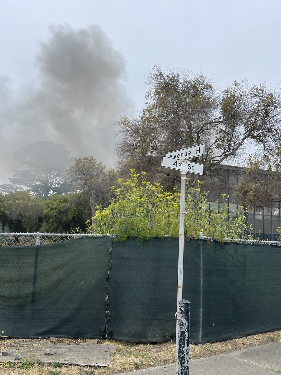 San Francisco firefighters are actively combating a one-alarm structure fire in a three-story abandoned building located on Treasure Island at Fourth Avenue and Avenue H.
