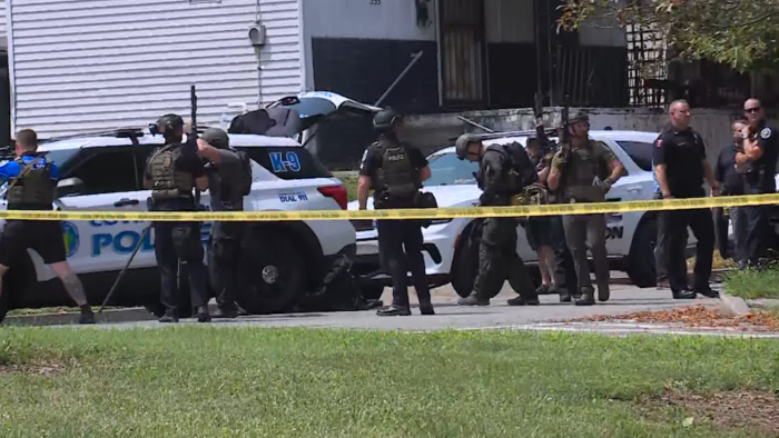 A reported standoff has prompted a large police presence in Covington. Multiple agencies are on scene.