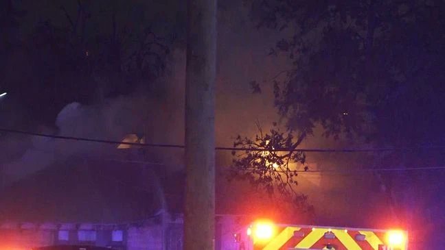 Firefighters battle massive 2-alarm fire that spread to nearby home on North Side