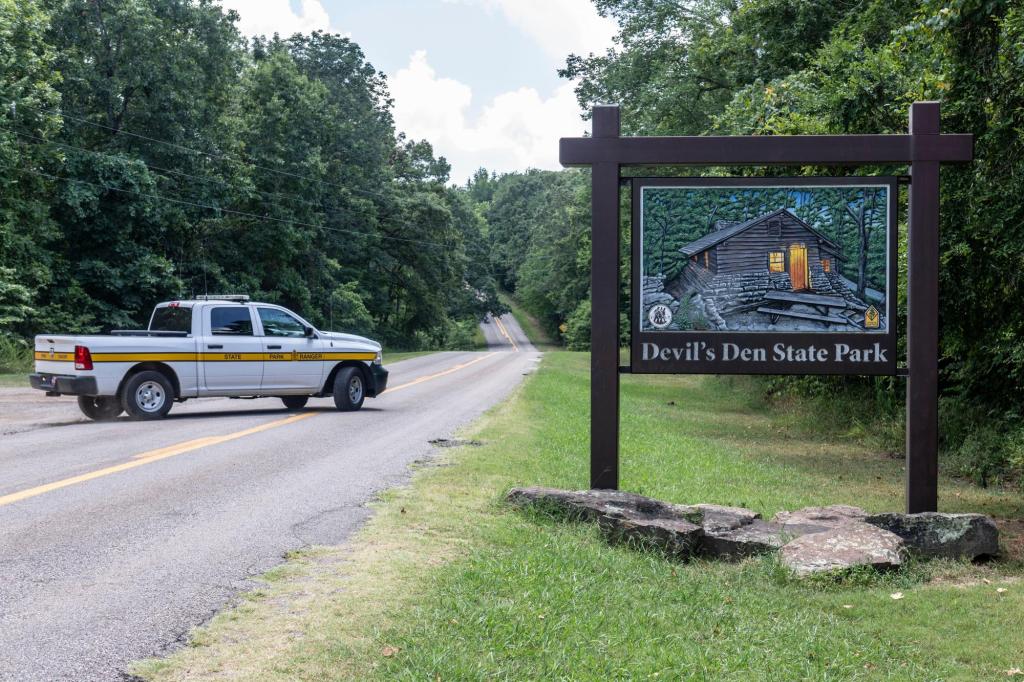 Teacher charged in fatal stabbing of couple on a hike with their kids is ordered held without bond