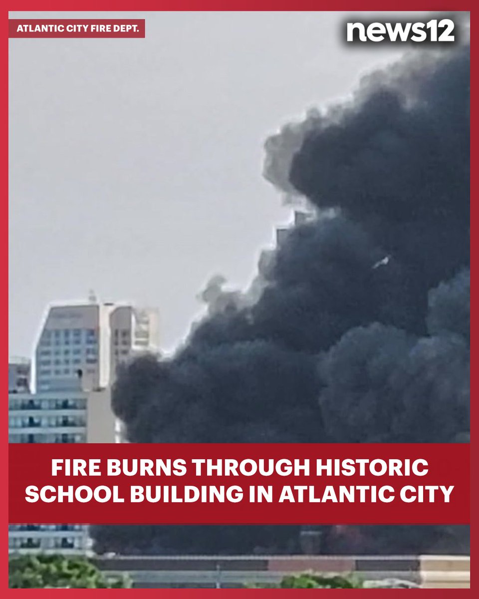 A massive fire tore through the 100-year-old New Jersey Avenue School in AtlanticCity, sending thick smoke into the air