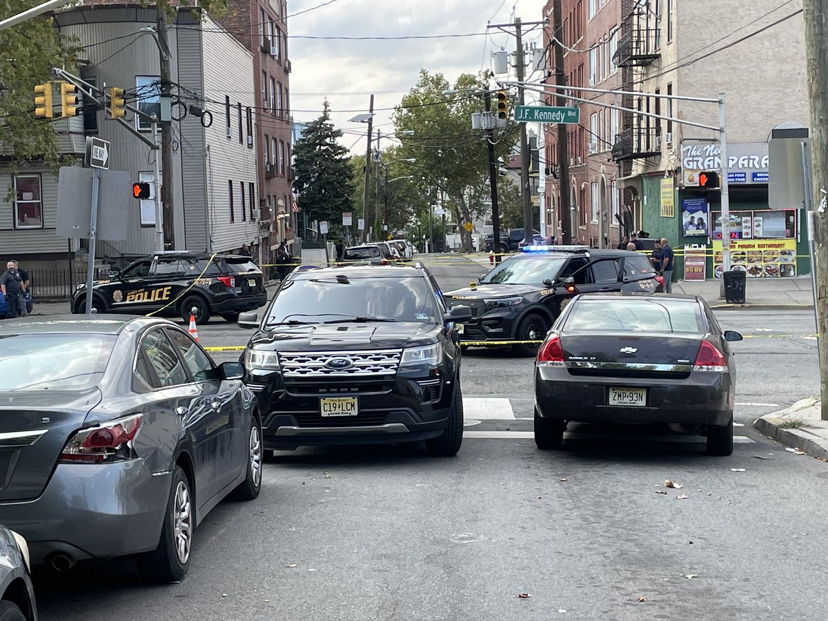 At the scene of a shootout in JerseyCity. Officials say two police cars were shot at while driving down JFK Blvd. The officers were uninjured. The  gunman is in the hospital.Working to learn more.