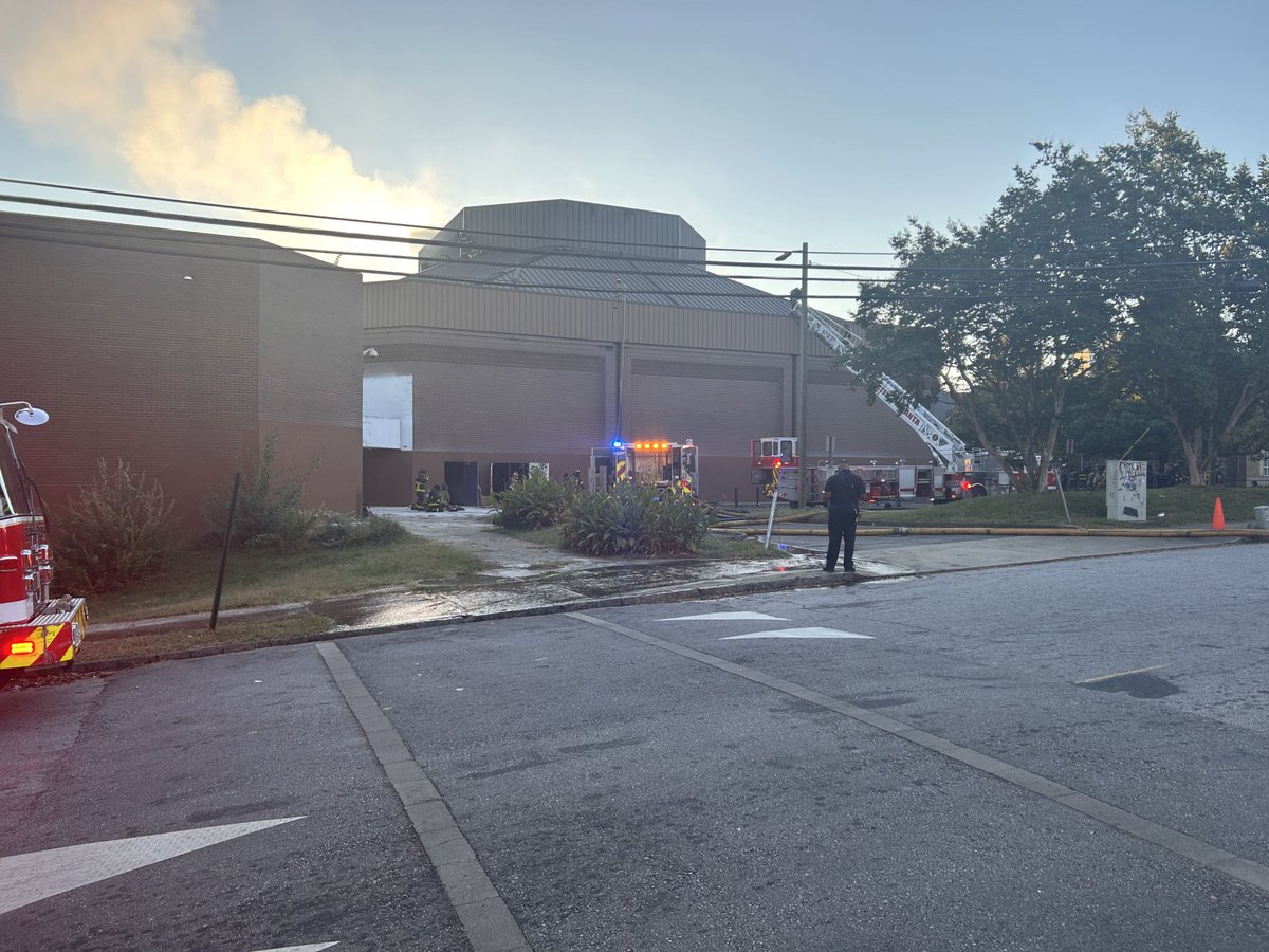 Firefighters are working to find the source of a fire at a building on the Morris Brown College campus in Atlanta