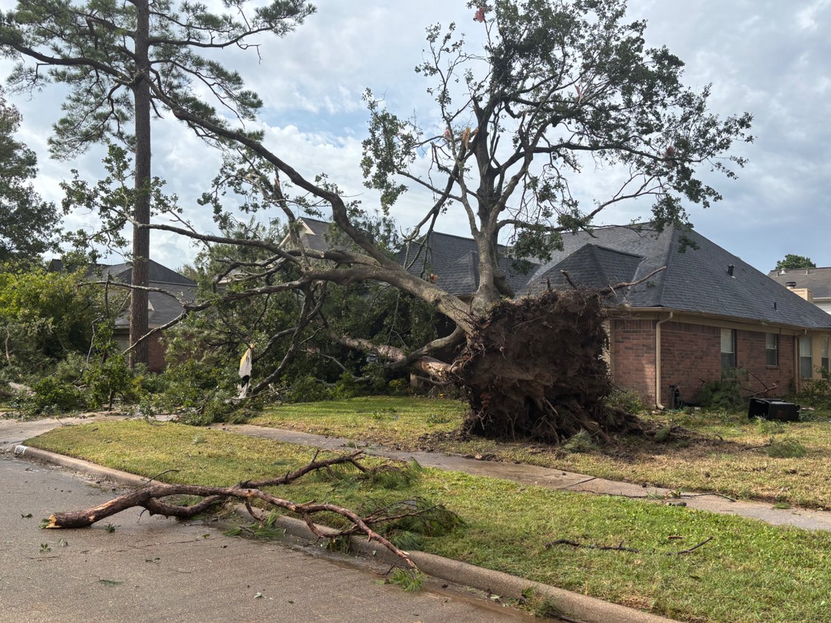 Confirmed structural damage and downed trees from an *unconfirmed* tornado in Spring, TX. This is along Village Hills Drive.