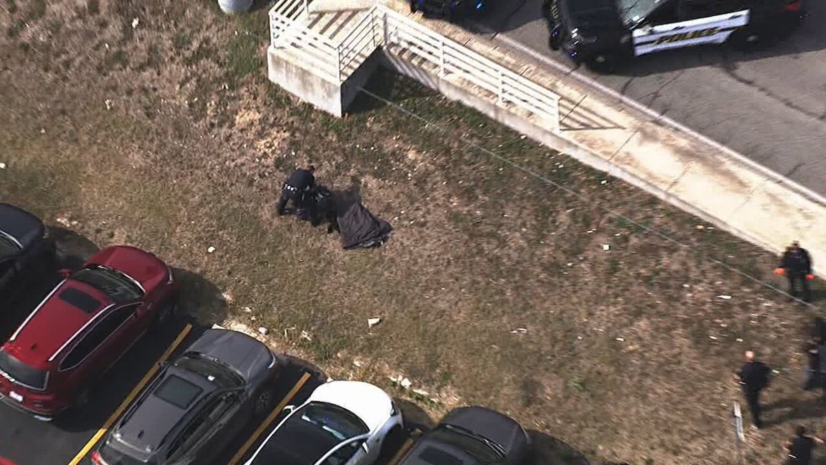 Police officers were seen taking down a person after calls for a bomb threat near KENS-TV