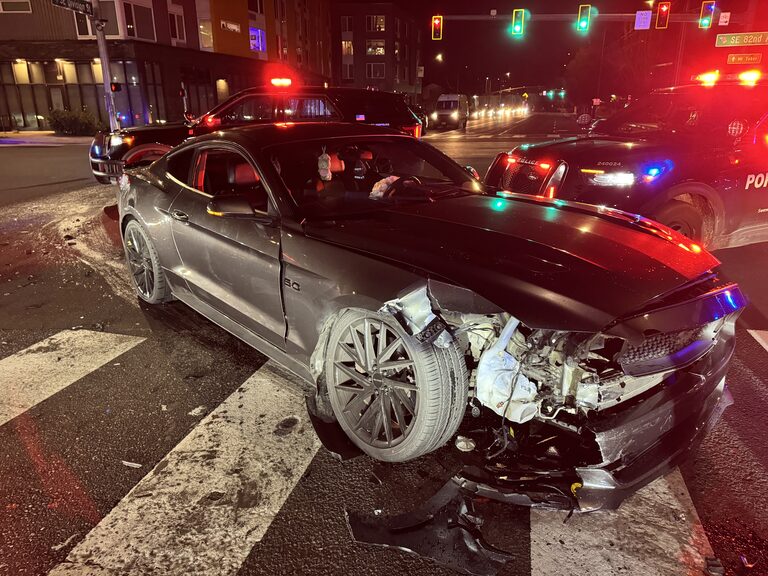 A 19-year-old accused of hitting and injuring a woman while doing donuts at a takeover in Northeast Portland on Thanksgiving night was caught three days later after he allegedly crashed into another car and took off running.
