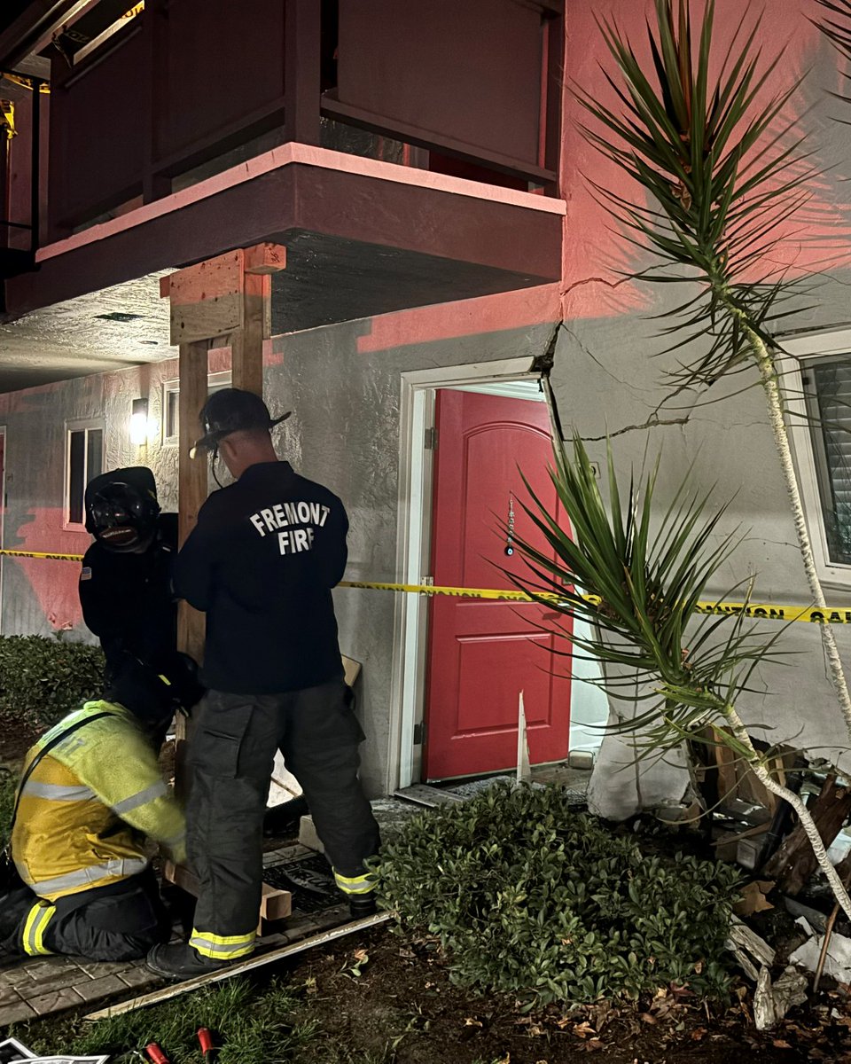 Five adults, a child and a cat were displaced after a car crashed into an apartment building in Fremont Wednesday, according to the fire department