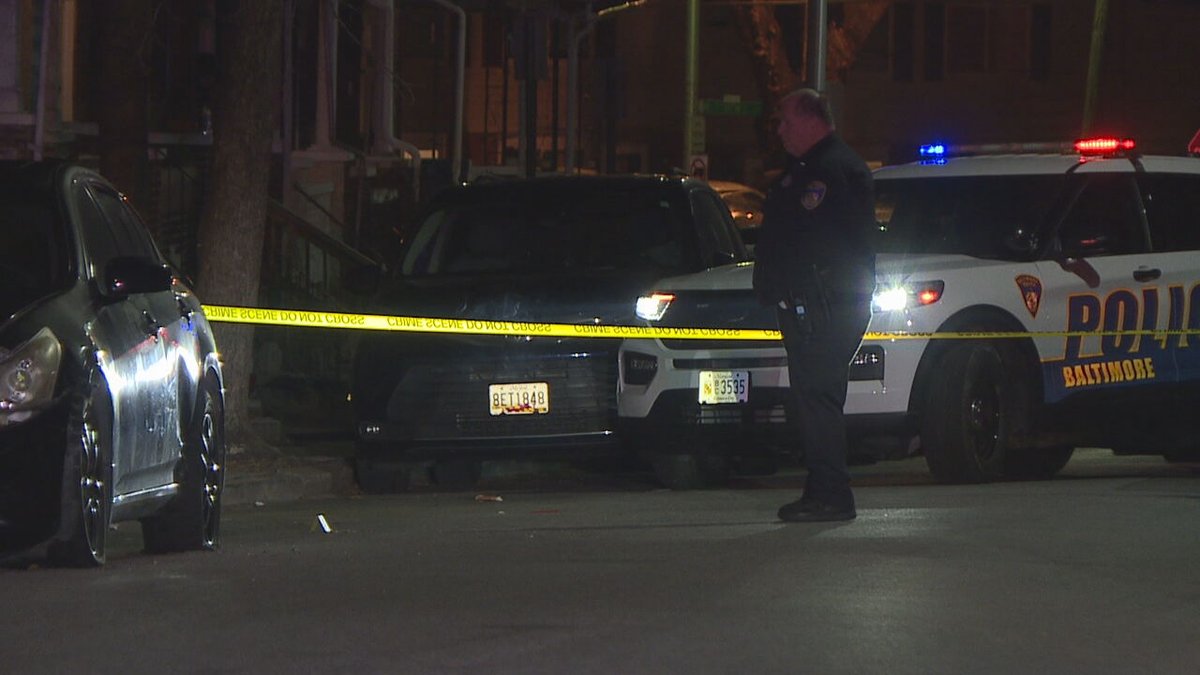 A dispute between neighbors led to one woman being arrested and another being hospitalized on Thursday night, Baltimore police said