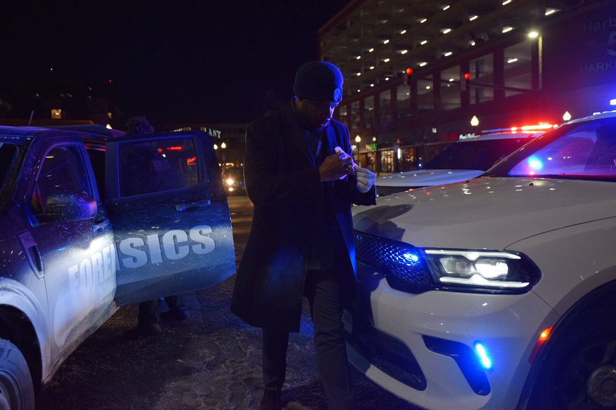 Homicide detective Sgt. Michael Gause leads a forensics examiner to the body of a man who was found deceased on the roadway in the 100 block of Market Place around 2:10 a.m. on Wednesday.