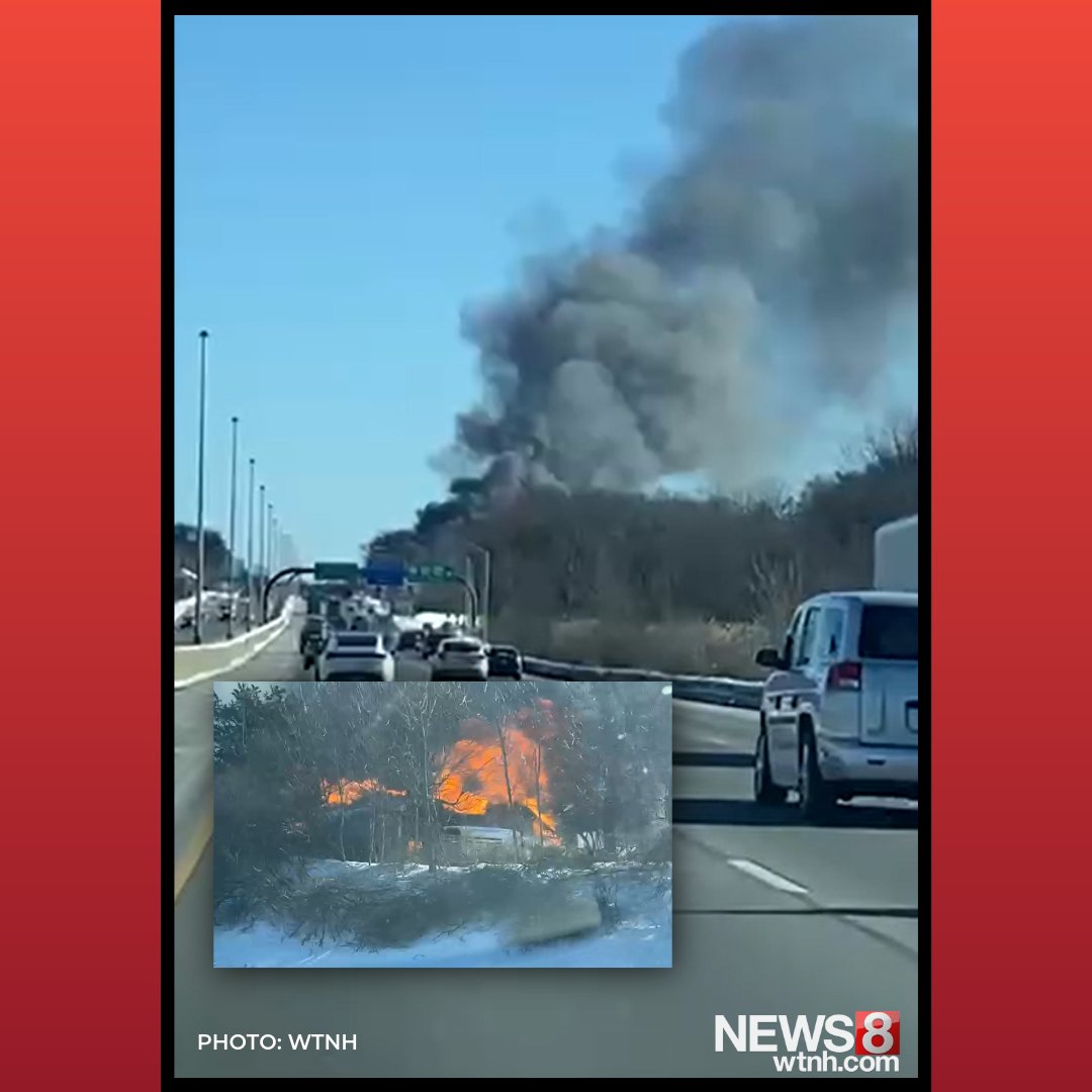 Heavy smoke and flames are visible off Interstate 95 in Branford