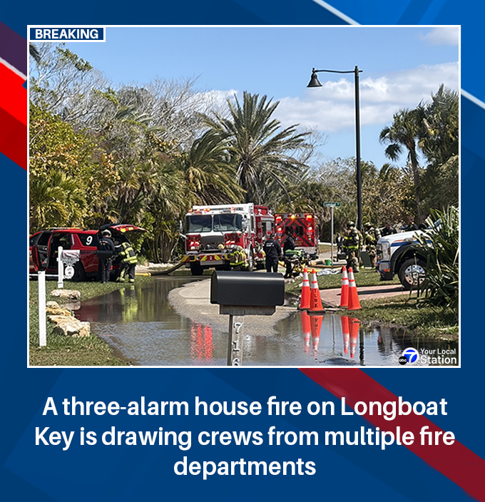 Crews from two county fire departments are battling a three-alarm house fire on Longboat Key