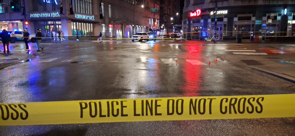 Pedestrian shot during shooting between cars 0-100 block of E. Chicago. Officers responded to a call for service. A 22-year-old male was driving a red sedan when he was approached by a white sedan occupied by an Rush Street somebody shooting out the back window of a car