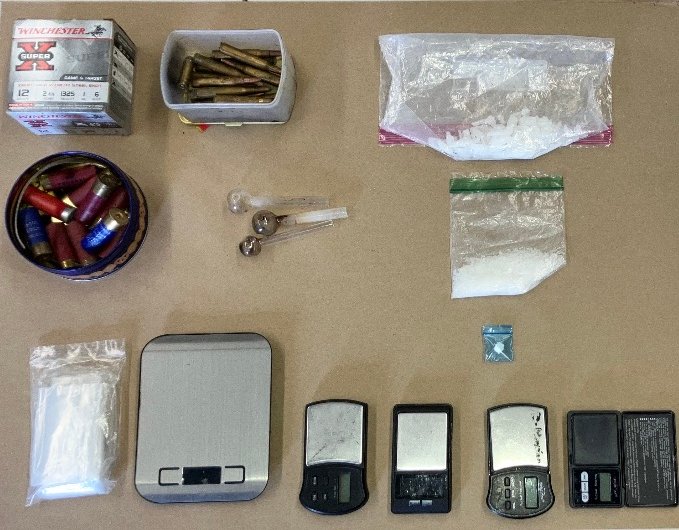 Five people were arrested after drugs, ammunition, and evidence of drug sales were found at a home in Visalia Wednesday