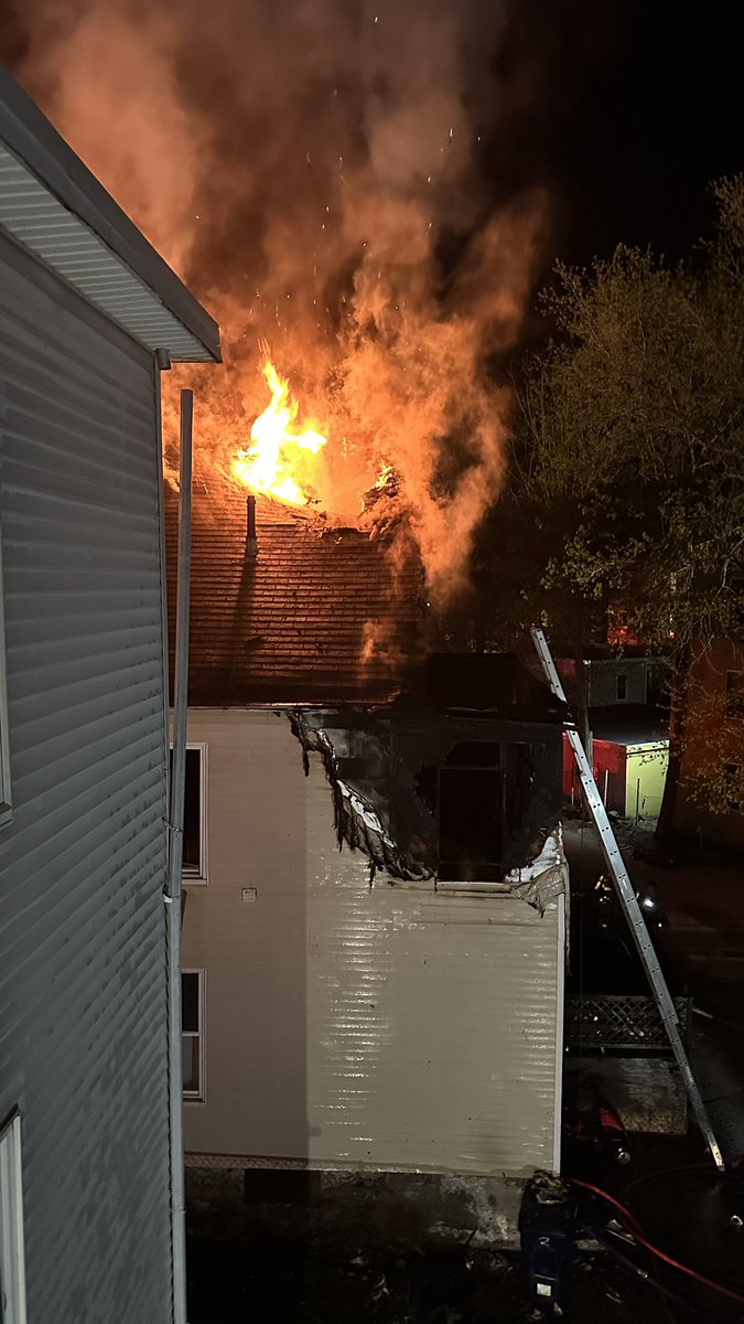 Heavy fire through the roof at the 3rd alarm in Southbridge now