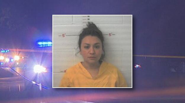 A woman was taken into custody after she allegedly provided alcohol to a teenager involved in a fatal single-vehicle crash