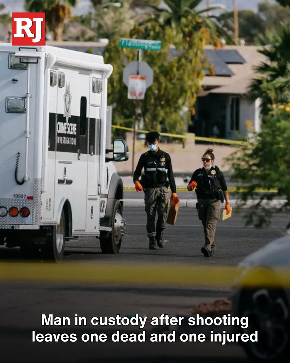 One man was taken into custody after two men were shot outside a business in the southeast Las Vegas Valley, prompting multiple 911 calls, according to police
