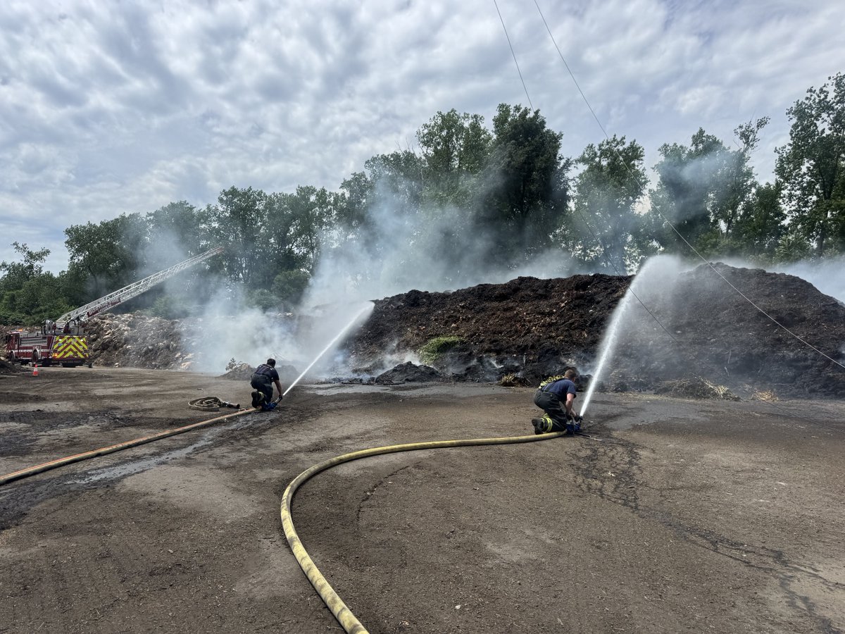 Firefighters are working at a large mulch fire at the landscape company on American Legion Hwy. Firefighters used 1000’s of feet of hose line to supply water to the fire.