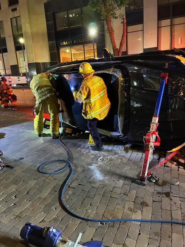 Pittsburgh EMS, Fire, and Police were dispatched to a single vehicle accident with entrapment near 4th Ave. and Grant St. Medic 14 arrived on scene within one minute of dispatch to find the vehicle on its side with two occupants trapped inside