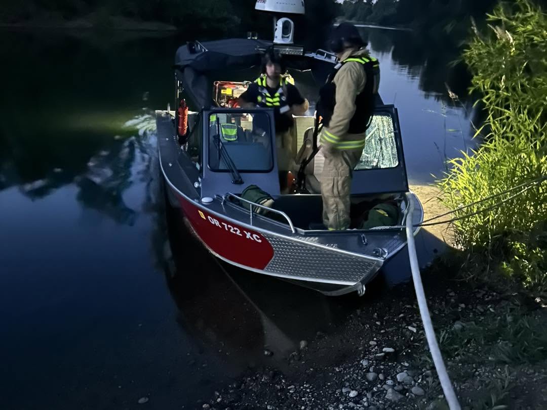 Firefighters worked to put out a fire that sparked on an island in the Willamette River near Dayton, Oregon on Tuesday night.