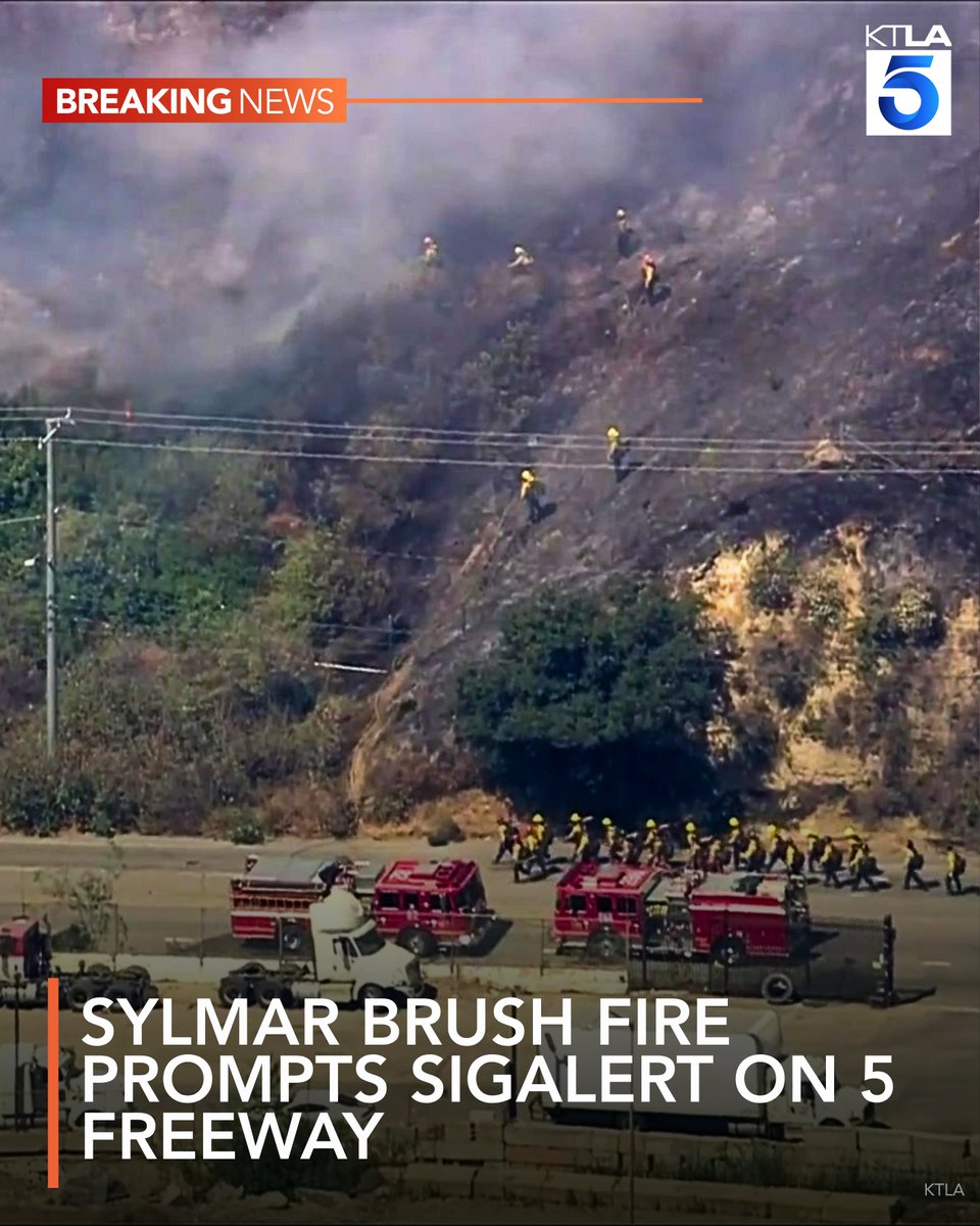 Firefighters are responding to a brush fire that has burned at least two acres and prompted a SigAlert on the 5 Freeway in Sylmar