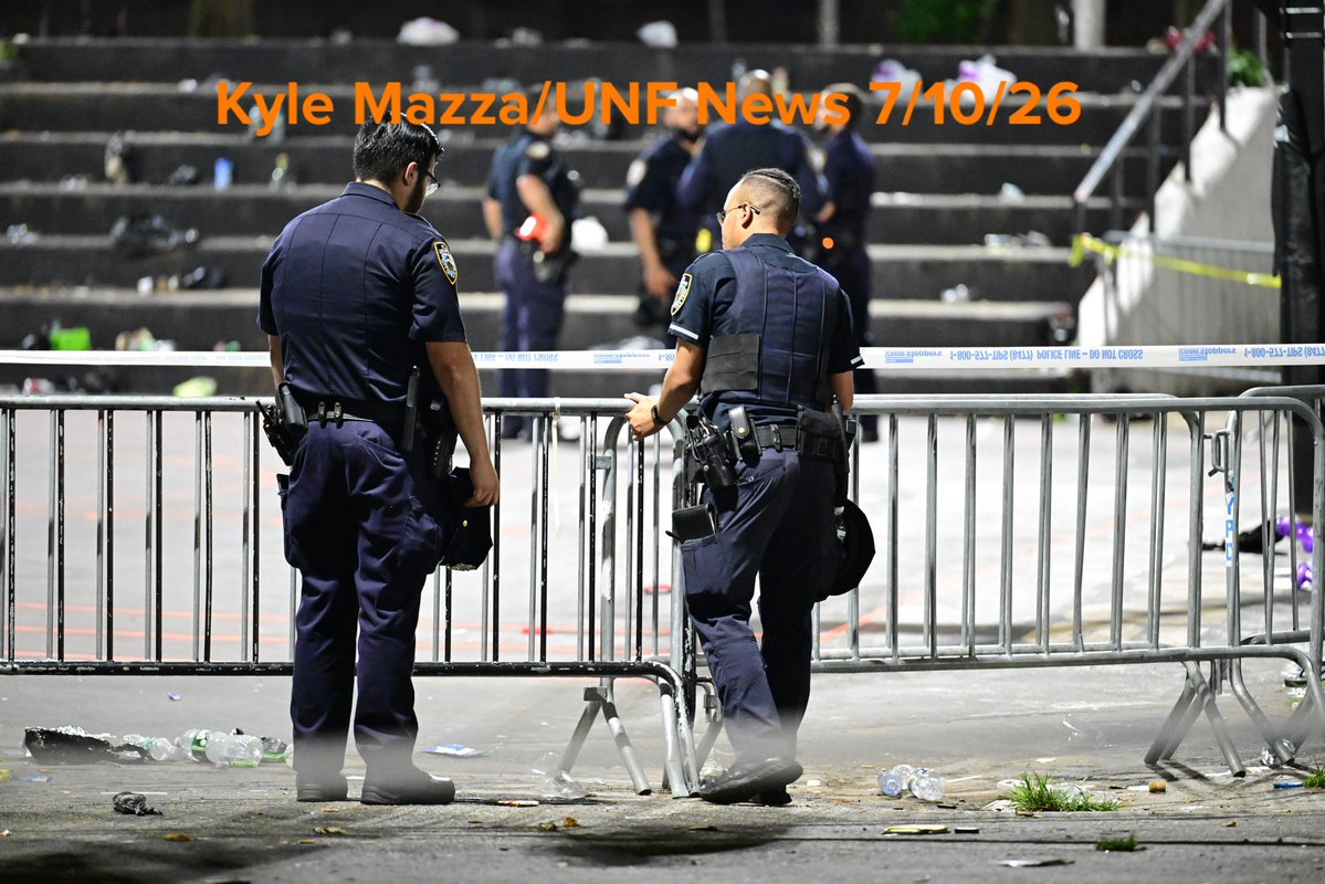 NYPD officers work the scene where one person was killed and two others were injured after a shooting inside of a basketball court at 70 Lenox Avenue within the confines of the 28 precinct PSA 5 in Manhattan, New York, United States