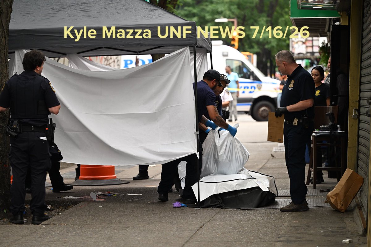 The body of a 29-year-old man who was fatally shot to the head is removed from the outside of a restaurant and lounge at 2362 Jerome Avenue within the confines of the 46 precinct in Bronx, New York, United States
