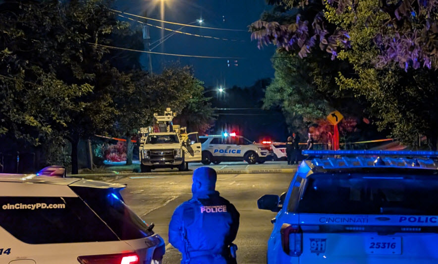 Cincinnati police on scene of early morning shooting that sends 1 person to hospital. Spectrum work truck among crime scene tape