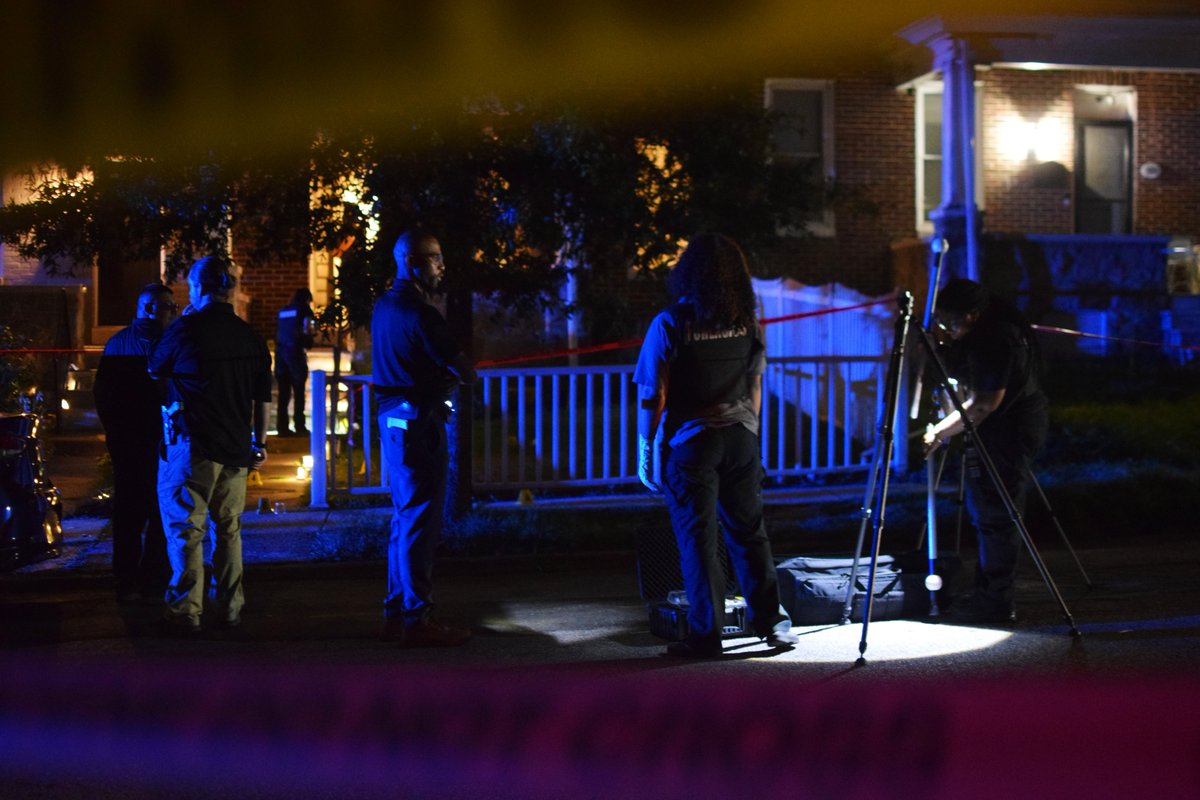 Crime lab technicians and detectives gather around a house where someone was shot on Friday morning.   gunshot victim was young and that there were other young people at the house when the shooting happened. The gunshot victim sustained life-threatening injuries