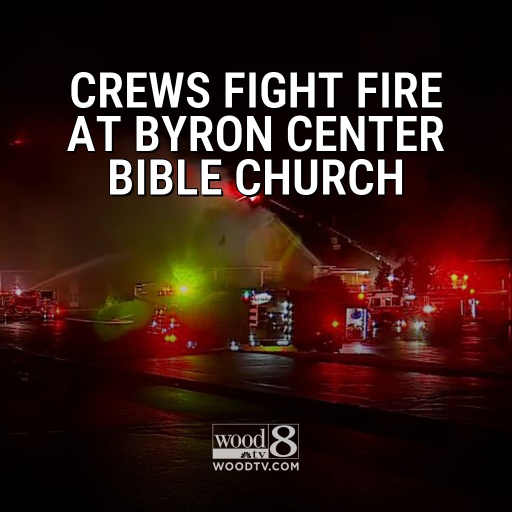 Fire crews blasted water on a Byron Center church amid rain early Monday as smoke and flames poured from the roof