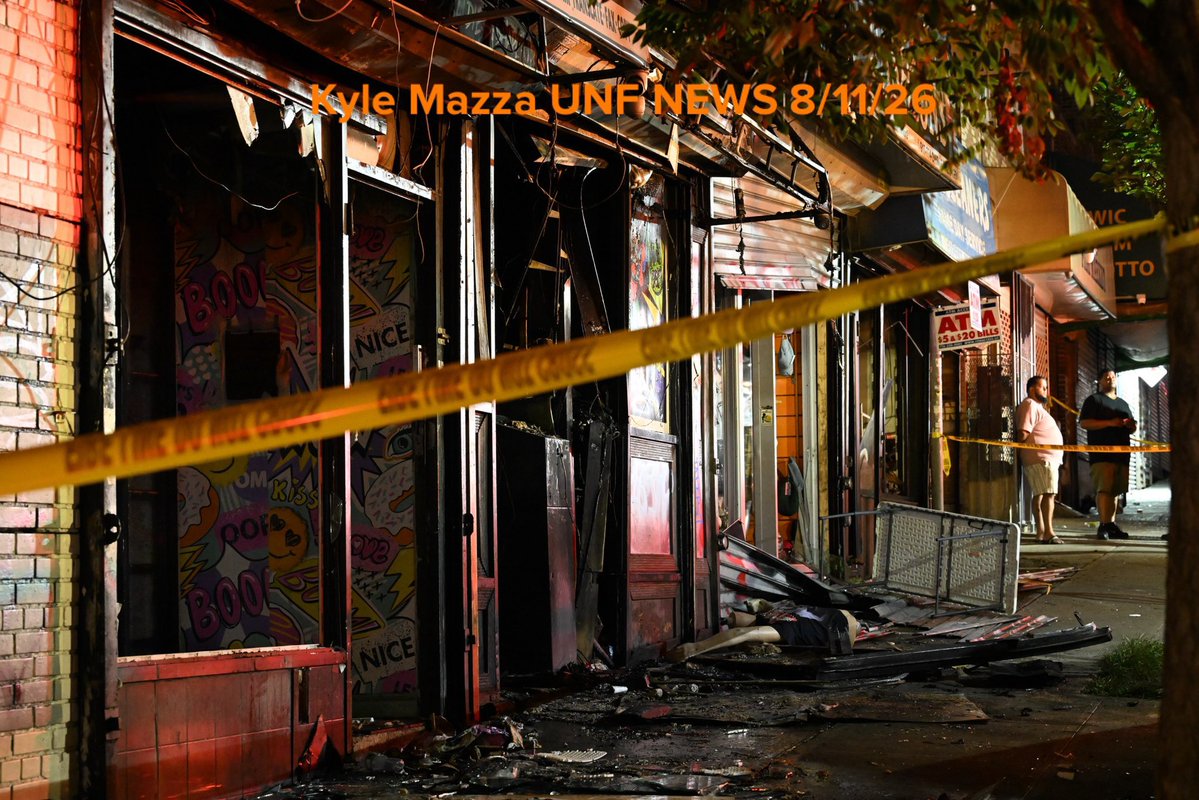 Members of the NYPD and FDNY work the scene of a fire that damaged several businesses in the area of West 183 Street within the confines of the 52 precinct in Bronx, New York, United States on August 11, 2026. Tuesday evening at approximately 10:11 pm the incident took place. A man in his 30s suffered severe burns to the face and body. Investigators are working to determine the cause of the fire.