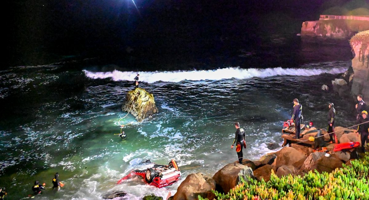 Two people were inside a car when it plunged over a cliff near Steamer Lane, a popular surfing spot in Santa Cruz, and landed in the ocean below. Rescue swimmers found one victim with fatal injuries inside the submerged car