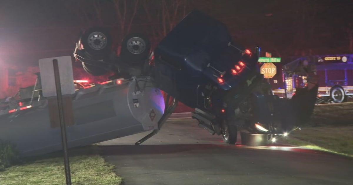 Tanker truck carrying 7,500 gallons of fuel overturns into ditch near creek