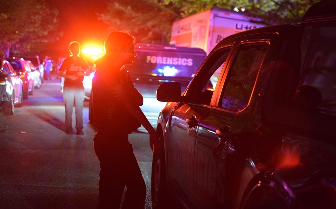 Crime lab technicians prepare to collect evidence of a fatal shooting in Shipley Hill on Saturday. Police were alerted to gunfire in the area around 2:40 a.m. They found a gunshot victim in the 2500 block of West Fayette Street