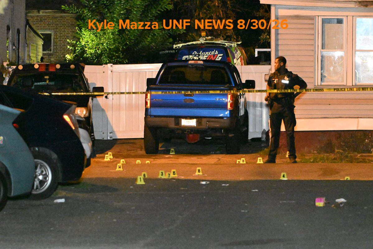 Evidence markers are seen on the ground where 2 people were killed and 9 people were injured in a mass shooting on Locust Street in Trenton, New Jersey, United States on Sunday