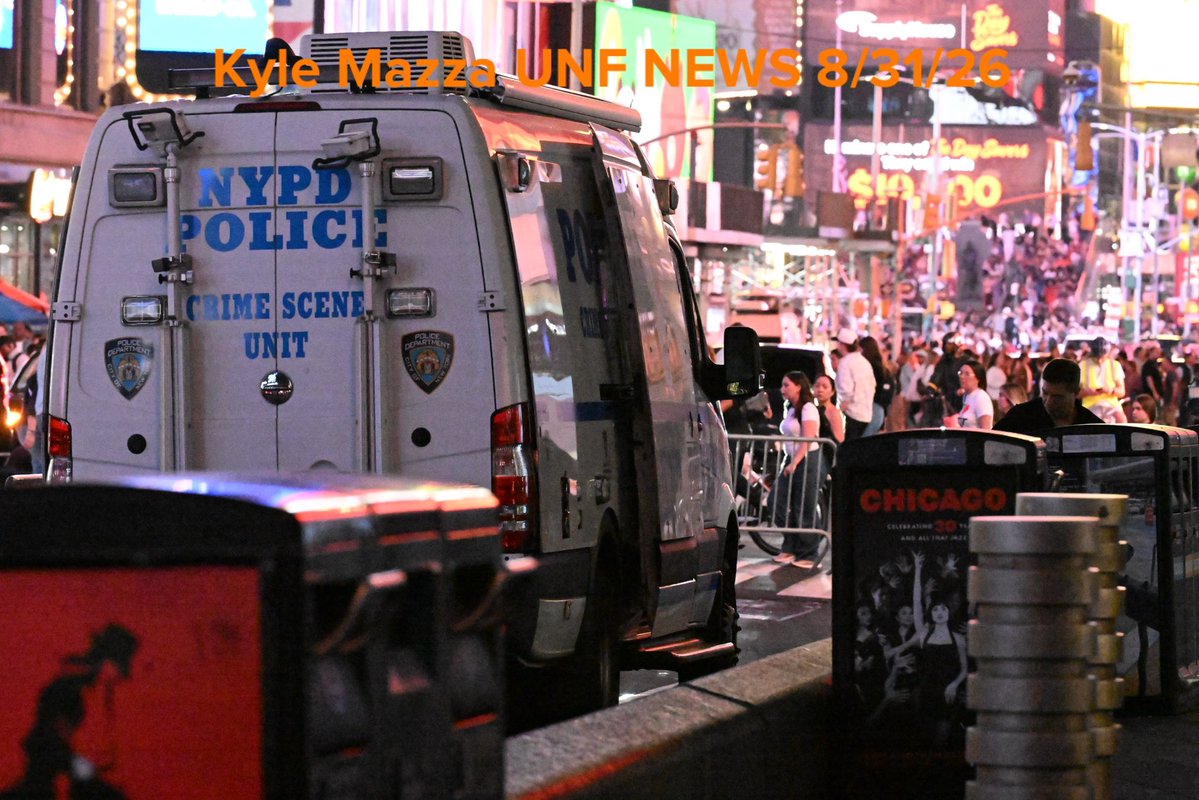 Crime scene unit investigators collect evidence including blood and shell casings at the scene after NYPD officers shot and killed a knife-wielding woman who fatally stabbed a woman and injured a man in Times Square near the area of West 42nd Street and 7th Avenue