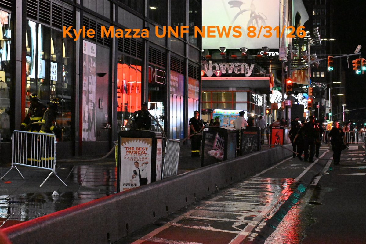 FDNY firefighters wash down the scene after NYPD officers shot and killed a knife-wielding woman who fatally stabbed a woman and injured a man in Times Square near the area of West 42nd Street and 7th Avenue in Times Square, Manhattan