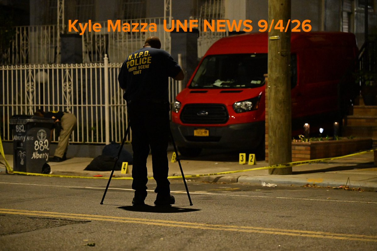 NYPD crime scene unit investigators mark evidence including a hat, broom, broom stick pieces and other items at the scene where 25-year-old Christopher Davey was fatally stabbed multiple times at 882 Albany Avenue within the confines of the 67 precinct in Brooklyn, New York, United States