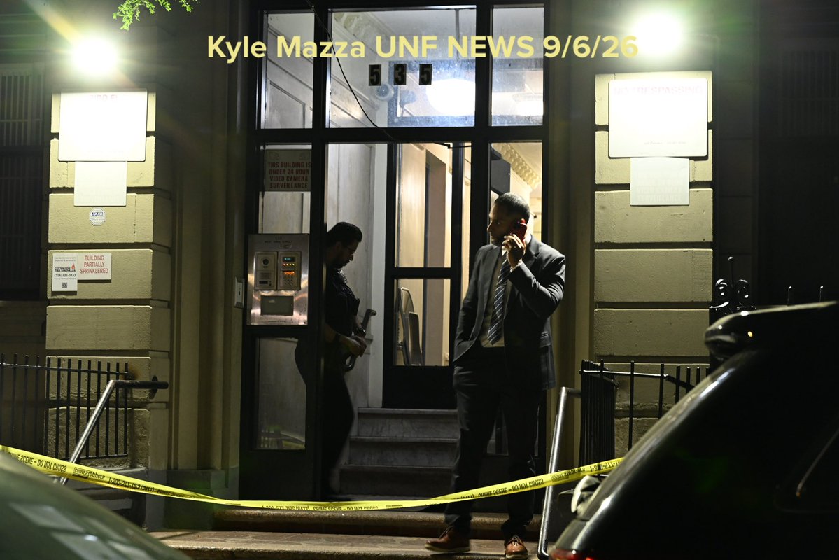 NYPD officers work the scene where a 27-year-old woman was murdered inside of 535 West 156 Street within the confines of the 33 precinct in Manhattan, New York, United States