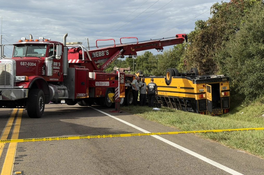 Two people, including a 10th-grade girl, were killed and several others injured Monday when a school bus overturned onto its roof in a multi-vehicle crash in Florida