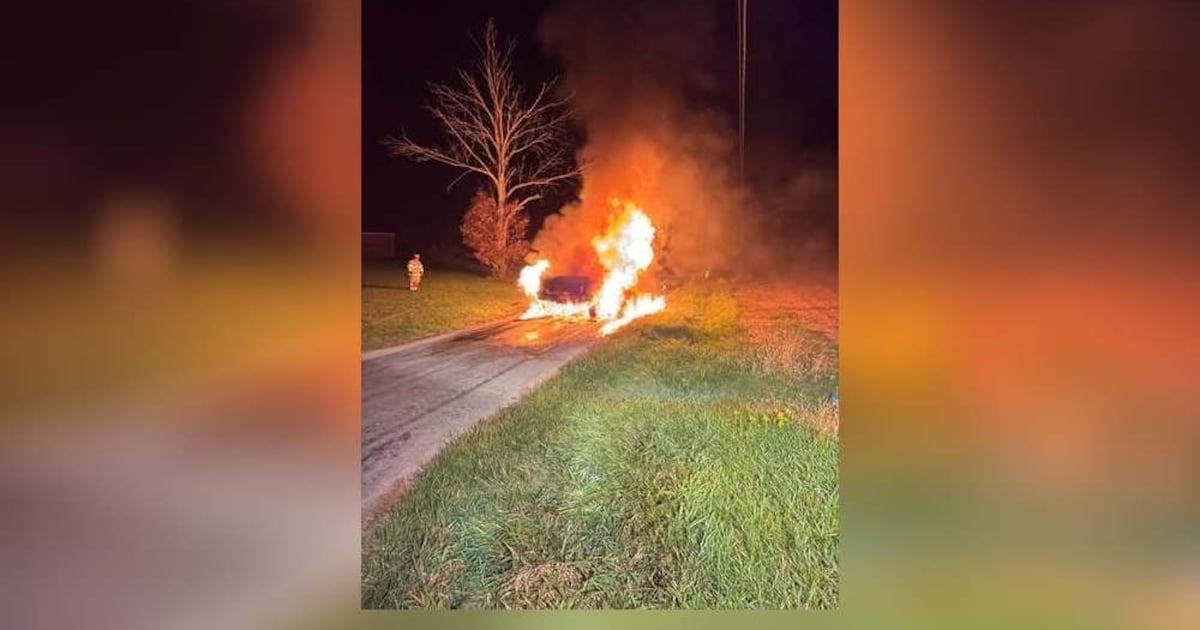 Firefighters extinguish car fire at area intersection
